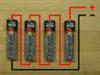 Figure 1) Batteries in series - The total voltage out is the sum of the voltage contribution of each cell. In this case 1.5 X 4 = 6V. The capacity remains the same as for one cell.