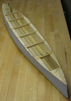 laminated model boat hull after carving