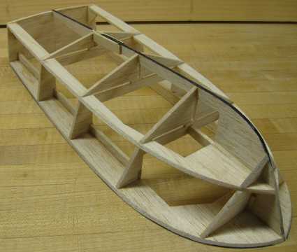 rc boat hull framed and partially sanded