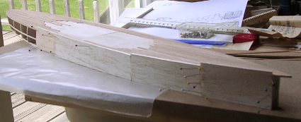 hull planking of 1/16 inch balsa sheet started photo